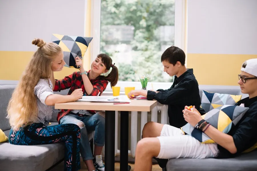 Youngsters hanging out table